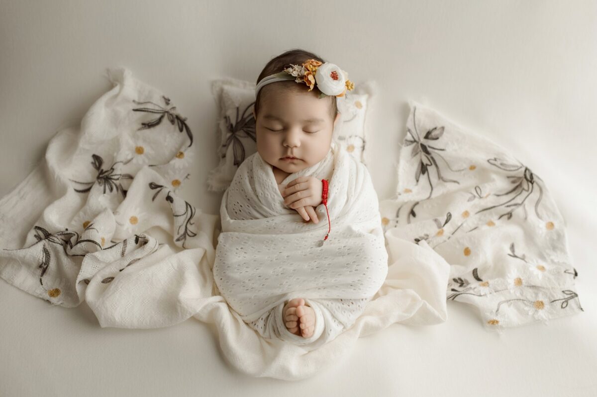 Wrapped newborn baby in cream knit wrap - Sugarloaf Photography Bel Air MD