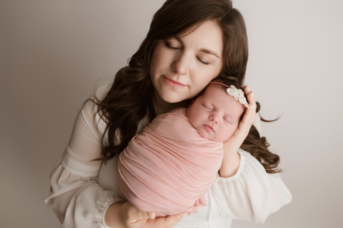 mom holding newborn baby girl Baltimore newborn photographer Sugarloaf Photography