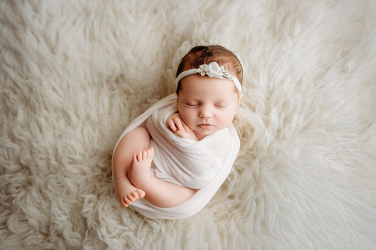 Baltimore newborn photographer baby Mia wrapped white knit Bel Air studio