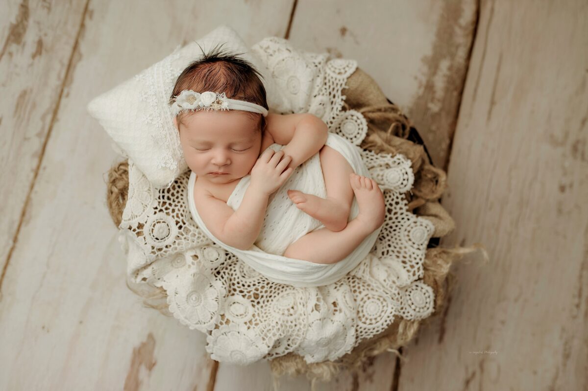 Semi wrapped newborn pose neutral tones Harford County newborn photographer