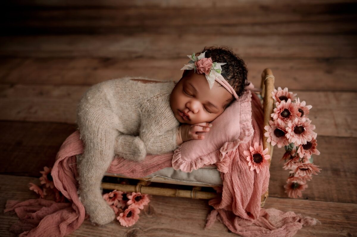 Maryland newborn photographer posing newborn safely
